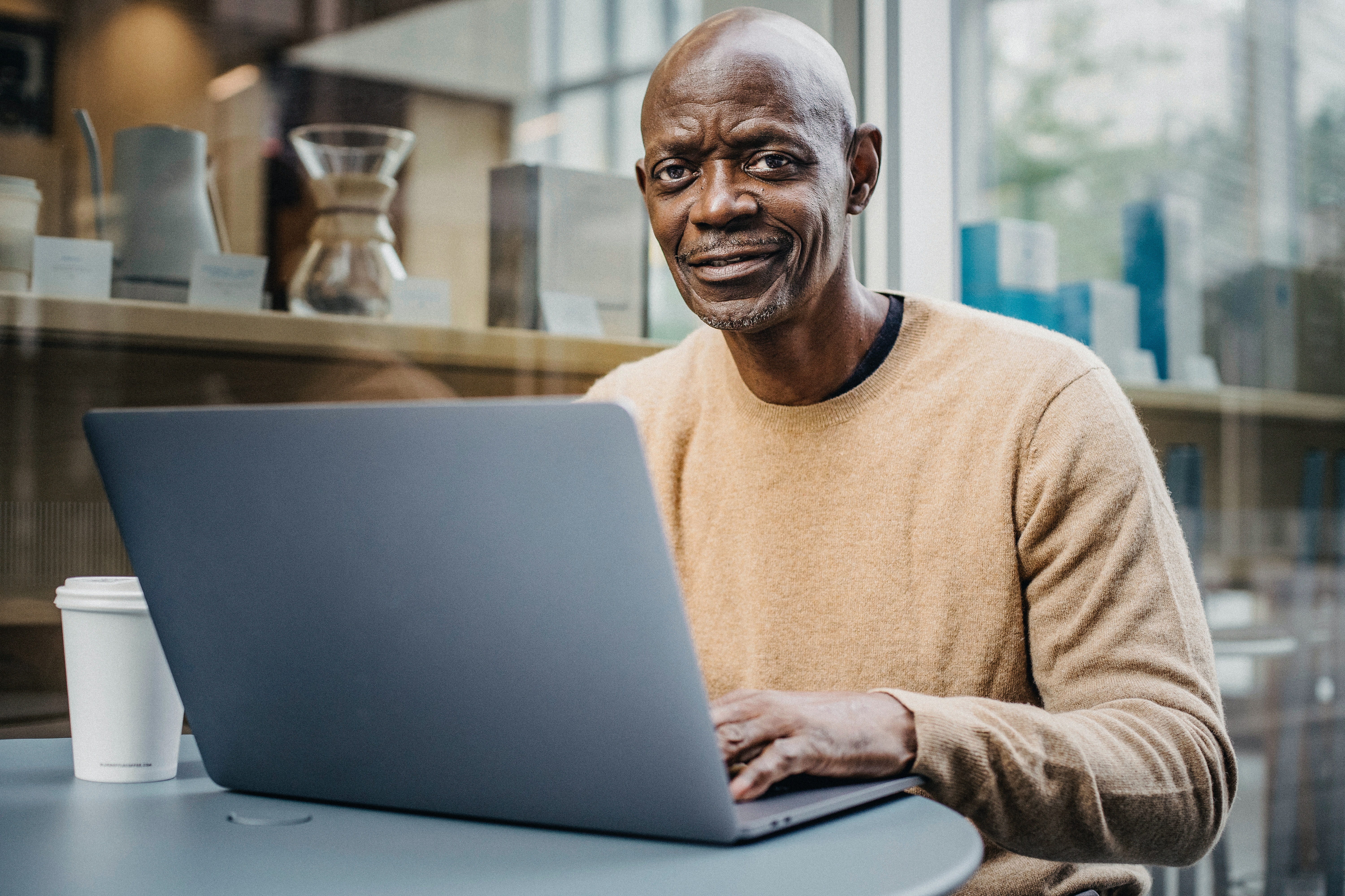 Older black man working at a laptop