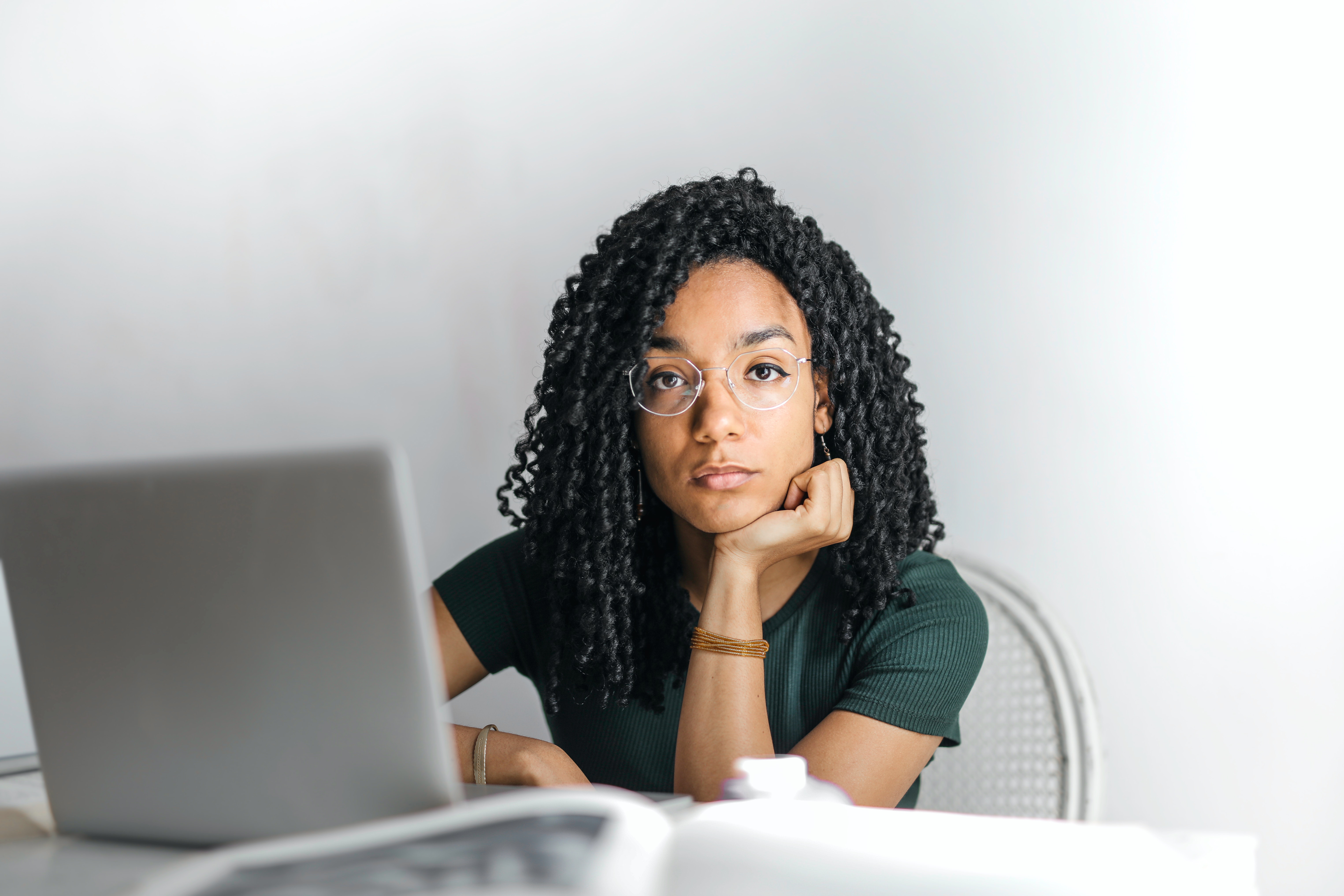 Black woman working at a laptop