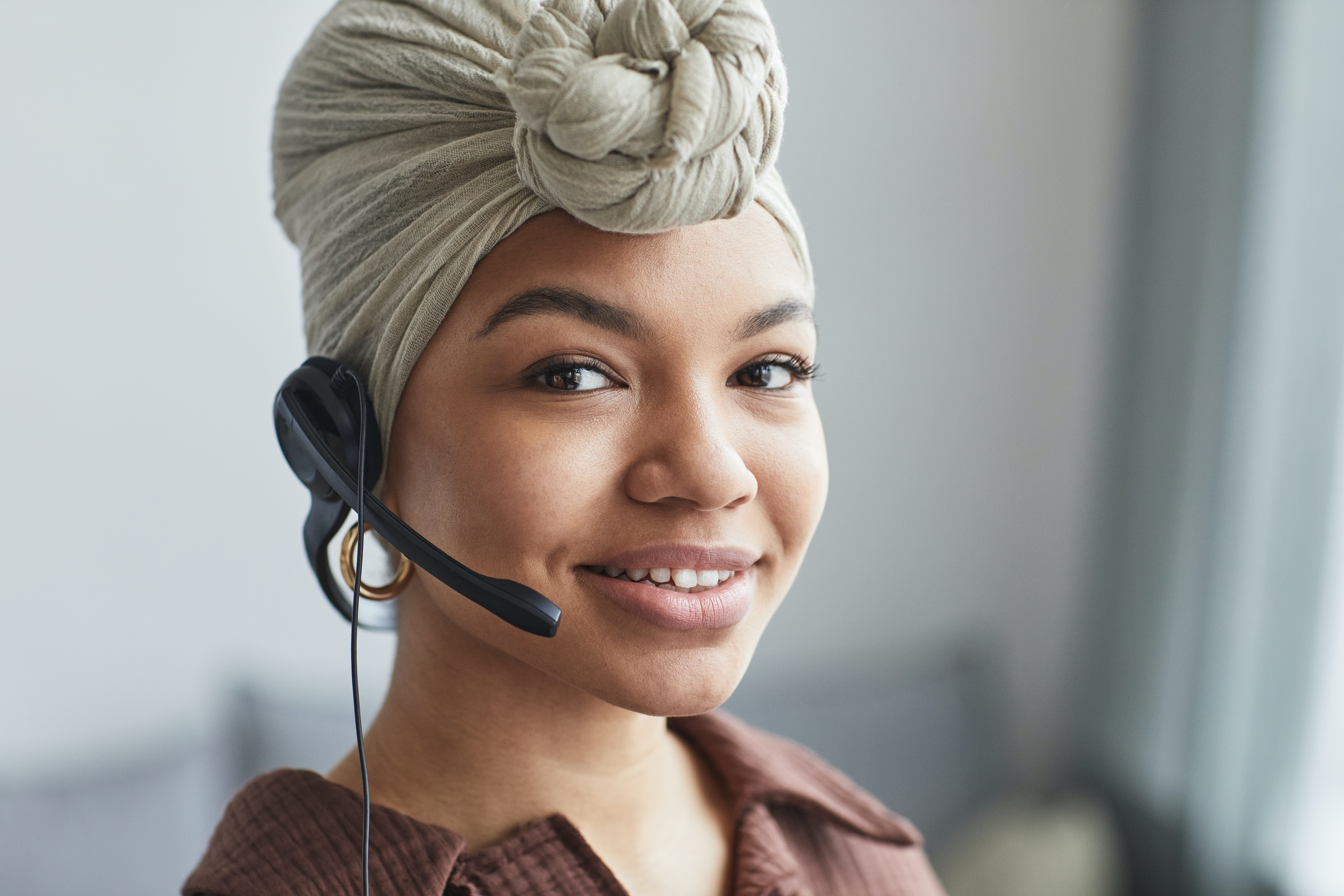 Ethnic woman talking on a telephone headset